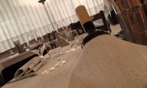 a long table with wine glasses on it at Hotel Palace in Rovigo