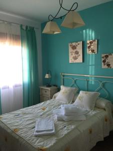 Giường trong phòng chung tại Casa Cuatro Vientos - Barranco Del Sol