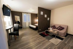 Postel nebo postele na pokoji v ubytování Hôtel Pédagogique Coeur d'Apcher