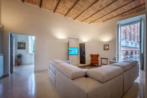 a living room with a couch and a table at La Residenza in Piazza Grande in Foligno