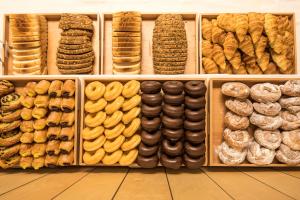 a display of different types of donuts and pastries at Hotel Airiños 3* in Cangas de Morrazo