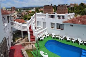 an aerial view of a house with a swimming pool at Atenea in Villa Carlos Paz