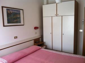 Postel nebo postele na pokoji v ubytování Hotel Graziana