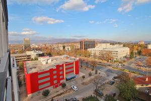 a view of a city with a red building at Luxury Skopje Apartments Premium in Skopje
