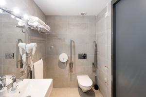 a bathroom with a toilet and a sink at Yeah Barcelona Hostel in Barcelona