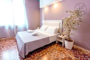 Postel nebo postele na pokoji v ubytování Hotel Paganini