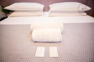 Postel nebo postele na pokoji v ubytování Hotel Paganini