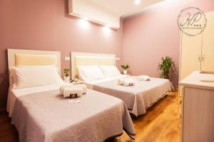 Postel nebo postele na pokoji v ubytování Hotel Paganini