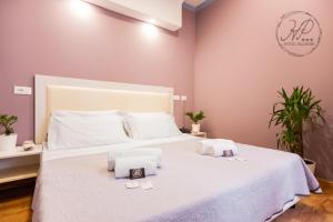 Postel nebo postele na pokoji v ubytování Hotel Paganini