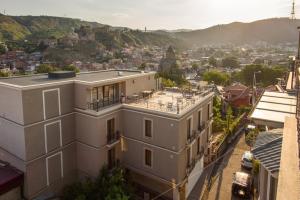 a building with a view of a city at KMM Hotel in Tbilisi City