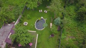 an overhead view of a garden with a pond at Takht House in Dilijan