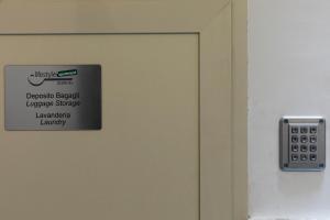 a close up of a door with a sign on it at Acate81 Lifestyle Apartment in Naples
