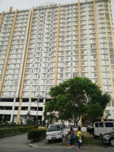 a large building with people walking in front of it at Evelyn's Place at Tagaytay 2 in Tagaytay