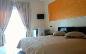 Postel nebo postele na pokoji v ubytování HOTEL AL QUERCETO