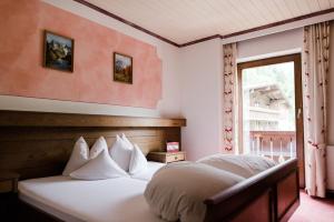 Posteľ alebo postele v izbe v ubytovaní Das Naturhotel die Eng