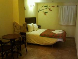 A bed or beds in a room at Bozquez Rural