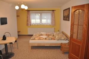 Posteľ alebo postele v izbe v ubytovaní Apartmány Florian