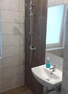 Kúpeľňa v ubytovaní Ogrodowa Apartments