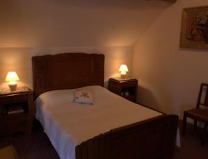 Un pat sau paturi într-o cameră la Le Clos de Châtres