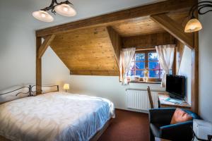Postel nebo postele na pokoji v ubytování Wellness Hotel Holzberg