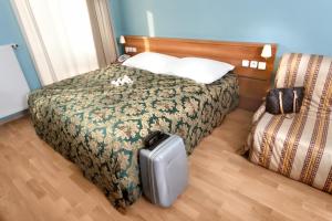 Postel nebo postele na pokoji v ubytování Hotel Residence Select