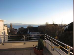 a balcony with a view of the water at Mühlgarten in Immenstaad am Bodensee +1 photo