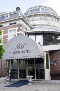 a trianon hotel sign in front of a building at Budget Trianon Hotel in Amsterdam