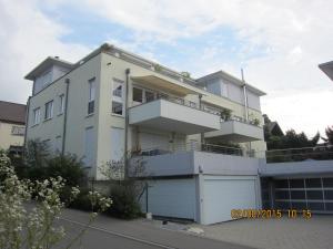 a large white house with a garage at Mühlgarten in Immenstaad am Bodensee