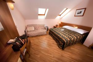 Postel nebo postele na pokoji v ubytování Hotel Residence Select