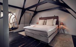 Krevet ili kreveti u jedinici u objektu HUISJES AAN DE AMSTEL - Your home away from home