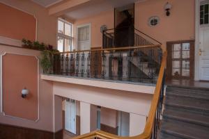 a winding staircase in a home with a stair case at Knez Mihailova Apartman in Belgrade