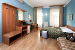 Postel nebo postele na pokoji v ubytování Hotel Residence Select
