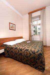 Postel nebo postele na pokoji v ubytování Hotel Residence Select