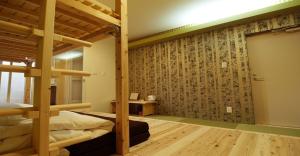 a bedroom with two bunk beds and a wall with a mural at 41-2 Surugamachi - Hotel / Vacation STAY 8330 in Nara