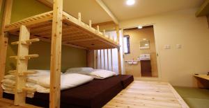 a bedroom with a bunk bed with a ladder at 41-2 Surugamachi - Hotel / Vacation STAY 8330 in Nara