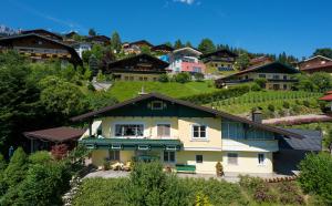 a house in the middle of a village at Apartment Lausbuam in Mühlbach am Hochkönig