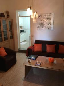 a living room with a couch and a coffee table at Casa Norb in Teror