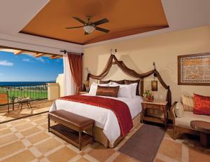 a bedroom with a bed and a view of the ocean at Secrets Puerto Los Cabos Golf & Spa18+ in San José del Cabo