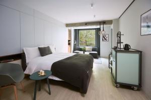Postel nebo postele na pokoji v ubytování Stey Beijing Wangfujing Hotel