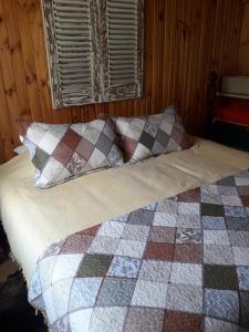 Postel nebo postele na pokoji v ubytování Hostal Arce Marrón