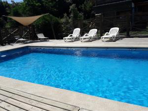 Bazén v ubytování Hostal Arce Marrón nebo v jeho okolí