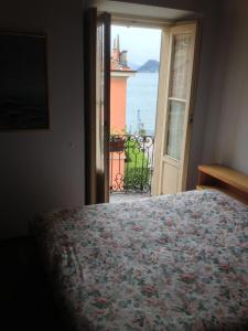Ένα ή περισσότερα κρεβάτια σε δωμάτιο στο Albergo Il Vapore