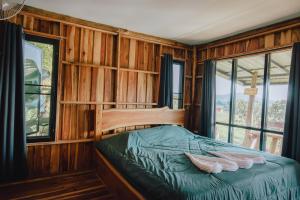 a bedroom with a bed with two white pillows on it at Ob-Oon Khao Kho Resort in Khao Kho