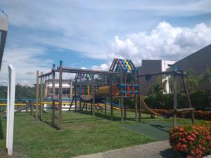 a playground in a park with a slide at Cabaña Ciudadela Premium San Jeronimo in San Jerónimo