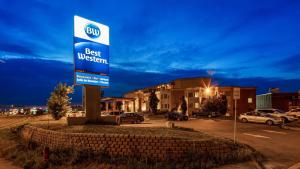 a sign for a best western in a parking lot at Best Western Laval-Montreal & Conference Centre in Laval