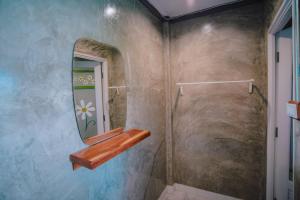a bathroom with a mirror and a shower at Ob-Oon Khao Kho Resort in Khao Kho