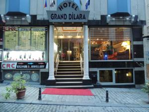 a store with a red carpet in front of a building at Grand Dilara Hotel in Istanbul