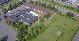 an overhead view of a large building with a parking lot at Hotel Falster in Nykøbing Falster