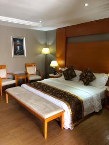 Hotel Sunshine Enugu客房内的一张或多张床位