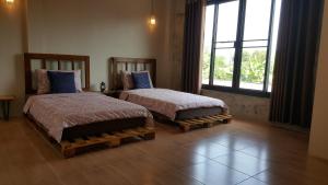 Ένα ή περισσότερα κρεβάτια σε δωμάτιο στο Baan Canalee (บ้านคานาลี)